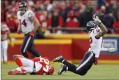  ?? JEFF ROBERSON — THE ASSOCIATED PRESS ?? Houston Texans wide receiver Kenny Stills (12) is tripped up by Kansas City Chiefs cornerback Rashad Fenton
(27) during a reverse play in the second half of an NFL divisional playoff game Sunday in Kansas City, Mo.