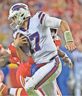  ?? PETER AIKEN/AP ?? Bills quarterbac­k Josh Allen rushes against the Chiefs on Sunday in Kansas City, Mo. The Bills won 38-20.