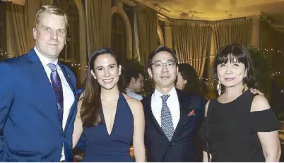  ??  ?? The hosts, The Peninsula Manila GM Mark Choon (second from right) and manager Patrick Behrens with Stephanie and Millet Mananquil