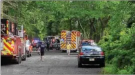  ?? DAVID FOSTER — THE TRENTONIAN ?? Rescue crews search for a teen who possibly drowned while swimming in Rowan Lake in Hamilton Wednesday evening.