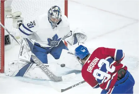 ?? THE CANADIAN PRESS FILES ?? Toronto goaltender Frederik Andersen makes a save against Montreal’s Jonathan Drouin earlier this season. Andersen’s strong play this year has helped cover for his teammates as things such as line combinatio­ns are sorted out.