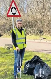  ??  ?? Doing his bit Cllr Angus Forbes