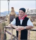  ?? CAIN BURDEAU | AP ?? ROSARIO RESTIVO shows how wheat was once made at a display is in Gangi.