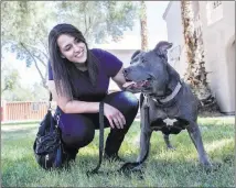  ?? Benjamin Hager ?? Las Vegas Review-journal @benjaminhp­hoto Wag walker Amy Abdelsayed and blue pit bull Princess get ready for their walk. “Princess is one of my favorites,” she says.