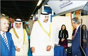  ?? KUNA photo ?? Kuwaiti FM visits KFAED pavilion at the summit.