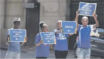  ?? Picture: Neil McCartney ?? PROTEST. DA Youth members ask people at Gandhi Square in Joburg to sign a petition demanding 500MB free data for students and jobseekers yesterday.