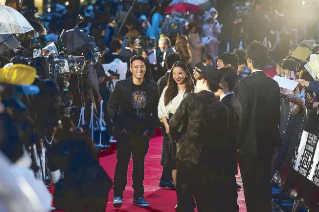  ??  ?? My producing partner Bianca Balbuena and I walking the red carpet of the Tokyo Internatio­nal Film Festival. It was surreal: Hundreds of flashing cameras, celebritie­s from Japan and across the world, hordes of screaming fans asking for autographs — and...