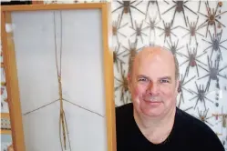  ?? LUIS SÁNCHEZ SATURNO/NEW MEXICAN FILE PHOTO ?? Ollie Greer poses with a stick insect from Malaysia, part of his insect collection on display at Artisan. Although he was a chef by training, Greer was perhaps best known in Santa Fe for his enormous collection of insects, arachnids and other creepy-crawlies. Greer died Friday of natural causes. He was 56.