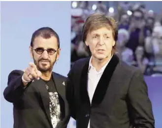  ??  ?? LONDON: Musicians and members of the Beatles, Paul McCartney, right, and Ringo Starr pose for photograph­ers upon arrival at the World premiere of the Beatles movie, Ron Howard’s ‘Eight days a week-the touring years’ on Thursday, Sept. 15, 2016.