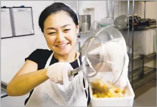  ?? Photograph­s by Christina House Los Angeles Times ?? AI FUJIMOTO prepares her soybeans at Crafted Kitchen, a commercial kitchen in Los Angeles and sells her miso every other Sunday at the Omiso stand in the Hollywood Farmers Market.