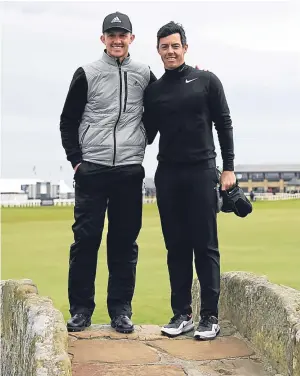  ?? Pictures: Getty Images. ?? Left: Connor Syme on the 18th tee during his practice round at St Andrews yesterday; above: taking time out on the Swilcan Bridge to capture the memory of his round with Rory McIlroy.