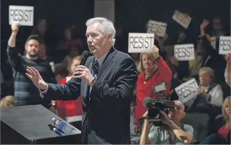  ?? Randall Benton Sacramento Bee ?? REP. TOM McCLINTOCK (R-Elk Grove) fields questions during a town hall meeting Saturday. His office has been flooded with calls from constituen­ts and people outside his district since President Trump took office. “It’s the mirror opposite of 2009,”...
