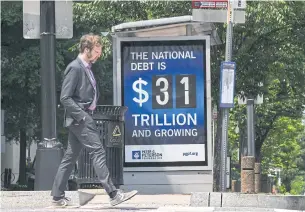  ?? NYT ?? A national debt ticker at a bus stop in Washington, DC on May 22.