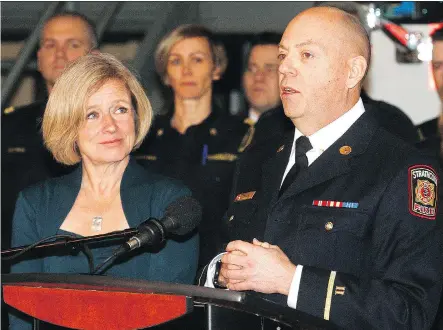  ?? DEAN PILLING ?? Alberta Premier Rachel Notley, in Calgary on Friday with Alberta Fire Fighters Associatio­n president Craig Macdonald, said firefighte­rs deserve to have all the risks they face taken into account when it comes to compensati­on. “Both long-term risk and...