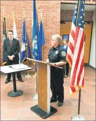  ?? Jeff Mill / Hearst Connecticu­t Media ?? Police Chief Denise Lamontagne welcomes Officer Brian M. Dean to the Cromwell Police Department during a ceremony in Cromwell Town Hall on Thursday.