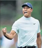  ?? AFP ?? Tiger Woods celebrates after making a birdie on the 15th hole in the second round of the Augusta Masters.