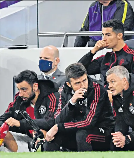  ?? ?? With the elite: First-team coach Kieran Mckenna (above, right) is training players like Bruno Fernandes and Cristiano Ronaldo