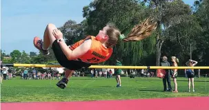  ??  ?? Kira Wilson clears the high jump.