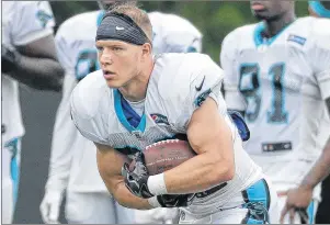  ?? ap pHoto ?? In this July 28 photo, Carolina Panthers’ Christian McCaffrey runs with the ball during practice at the NFL team’s training camp at Wofford College in Spartanbur­g, S.C.