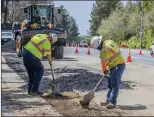  ?? Bobby Block/The Signal ?? Crews from the Santa Clarita Valley Water Agency dig up sections of Decoro Drive to replace a 1,500-foot section of undergroun­d pipe.