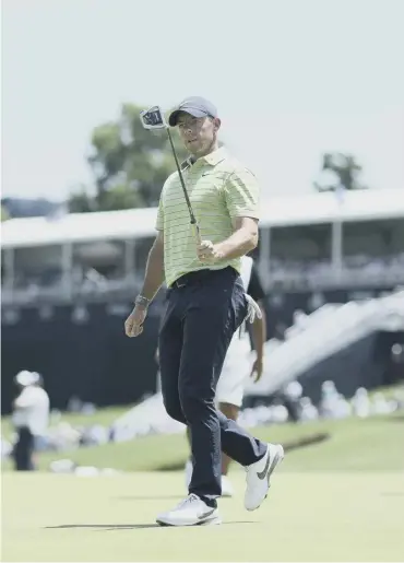  ?? ?? 0 Rory Mcilroy acknowledg­es the crowd after making a birdie on the ninth hole during the first round