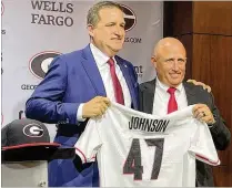  ?? CHIP TOWERS/AJC 2023 ?? Georgia AD Josh Brooks (left) introduced new baseball coach Wes Johnson to the media in June. Johnson takes over a program whose facilities are undergoing a $45 million renovation, including a new locker room and nutrition area.
