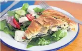 ?? ?? Pictured is the newly-opened restaurant, plus Greek salad and Spanakopit­a pie.