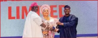  ?? ?? L-R: MD/CEO, Recepton Group, Otunba Odeyeyiwa Kazeem Olayeni, wife, Yeye Otunba Odeyeyiwa Adesola Mutiat, a director of the group, receiving the plaque of the award of 2023 national largest distributo­r of Dangote Cement brand, won by their subsidiary, Kazab Heritage Ltd, from aAhaji Aliko Dangote, President/ CEO of Dangote Group, in Lagos... recently