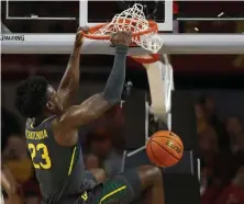  ?? ?? STILL PERFECT: Jonathan Tchamwa Tchatchoua and Baylor are one of two unbeaten teams remaining in Division I men’s basketball along with USC.