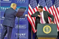  ?? AP PHOTO/JOHN BAZEMORE ?? In September 2020 President Donald Trump elbow bumps elbows with Herschel Walker during a campaign rally in Atlanta.