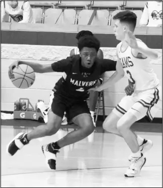  ?? Photo by Alexis Meeks ?? Malvern’s Elijah Mitchell tries to dribble past a defender during a recent game.