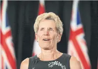  ?? RENÉ JOHNSTON/TORONTO STAR ?? Premier Kathleen Wynne gets teary-eyed as she addresses the media Friday after her party was reduced to only seven seats.