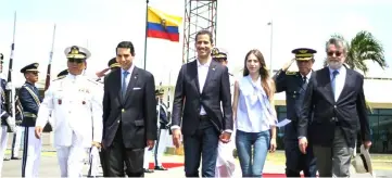  ??  ?? This handout picture released by Ecuador’s Presidency press office shows Guaido (centre) and his wife Fabiana Rosales receiving a presidenti­al farewell before departing from the airport in Salinas, Ecuador. — AFP photo