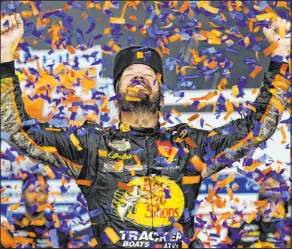  ?? Steve Helber The Associated Press ?? Martin Truex Jr. celebrates after winning a NASCAR Cup Series race at Richmond Raceway on Saturday in Richmond, Va.