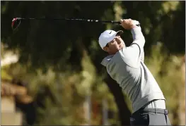  ?? SARAH STIER — GETTY IMAGES ?? Scottie Scheffler plays his shot from the fifth tee during the second round of the Phoenix Open at TPC Scottsdale on Friday in Scottsdale, Arizona.