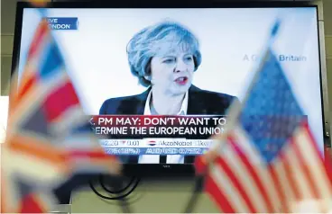  ?? /Bloomberg ?? Quid pro quo: A television screen shows British Prime Minister Theresa May making her Brexit speech on Tuesday. She said at London’s Lancaster House that Britain would seek a trade deal giving ‘the greatest possible access’ to the EU.
