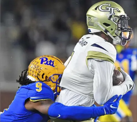  ?? Atlanta Journal Constituti­on ?? Pitt defensive back Brandon Hill tackles Georgia Tech’s Jalen Camp Thursday night in the Panthers 34-20 victory in Atlanta.