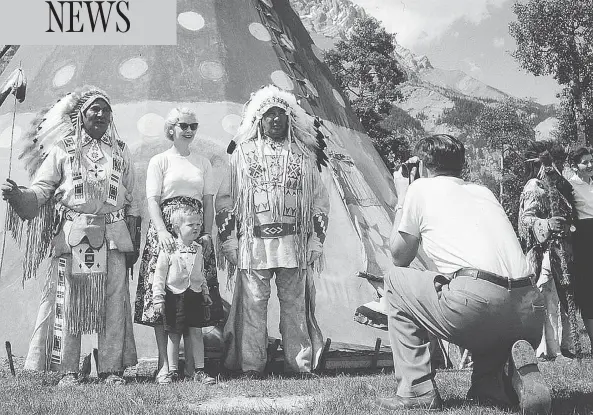  ?? ARCHIVES CANADA ?? A family takes part in the annual Banff Indian Days in 1957 in Banff National Park. Stoney band members were invited back to the land they once managed to entertain tourists until the event ended in the 1970s. Across Canada, Indigenous people were...