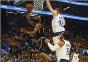  ?? NHAT V. MEYER — BAY AREA NEWS GROUP ?? The Golden State Warriors’ Andrew Wiggins (22) takes a shot against the Dallas Mavericks’ Maxi Kleber (42) in the first quarter of a Western Conference Finals playoff game at the Chase Center in San Francisco on Wednesday.