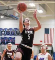  ?? RANDY MEYERS — THE MORNING JOURNAL ?? Anne Beirne of Rocky River scores on a drive in the lane during the first quarter against Bay.
