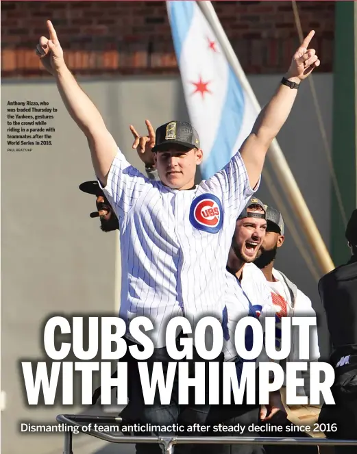  ?? PAUL BEATY/AP ?? Anthony Rizzo, who was traded Thursday to the Yankees, gestures to the crowd while riding in a parade with teammates after the World Series in 2016.