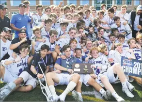  ?? Erik Trautmann / Hearst Connecticu­t Media ?? The Darien Blue Wave celebrates after winning against the Wilton Warriors in the Class L boys lacrosse championsh­ip on Saturday in Norwalk.