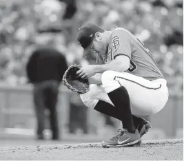  ?? MARCIO JOSE SANCHEZ/ASSOCIATED PRESS ?? Giants starter Ty Blach tries to collect himself before the start of the second inning against the Mets on Friday in San Francisco. Blach (4-5) lasted just three innings, giving up 11 hits and seven runs while striking out no one.