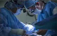  ?? Linda Davidson/ Washington Post ?? Surgeons transplant a kidney in 2015 at Medstar Georgetown University Hospital in Washington.