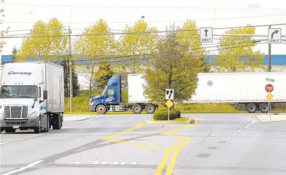  ?? THE MORNING CALL FILE PHOTO ?? Trucks drive alongside warehouses in 2014 near the intersecti­on of Boulder and Schantz roads in Upper Macungie Township.