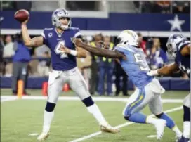  ?? MICHAEL AINSWORTH — THE ASSOCIATED PRESS ?? Cowboys quarterbac­k Dak Prescott (4) throws a pass under pressure from Chargers linebacker Melvin Ingram (54) in the second half, Thursday in Arlington, Texas.