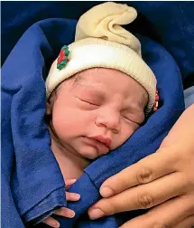  ?? AP ?? This December 15, 2017, photograph shows the baby girl born to a woman with a uterus transplant­ed from a deceased donor at the hospital of the University of Sao Paulo School of Medicine, Sao Paulo, on the day of her birth.