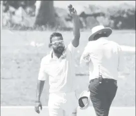  ?? ?? Veerasammy Permaul celebrates his 600th first class wicket on yesterday’s day one of the third Tri-Series match. (Photo courtesy CWI Media)