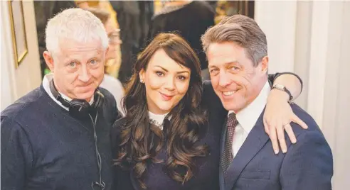  ??  ?? HAPPY REUNION: Director Richard Curtis with actors Martine McCutcheon and Hugh Grant.