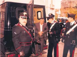  ?? Picture: EPA-EFE ?? THE BOSS. Sicilian Salvatore ‘Toto’ Riina being detained by members of the Carabinier­i military in Palermo, Sicily in 1993.